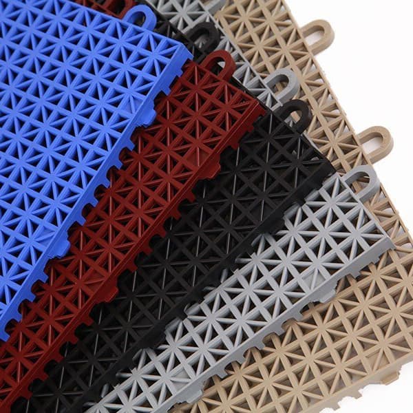 Drainage tiles fanned out on a white background in blue, maroon, black, gray, and tan colors.