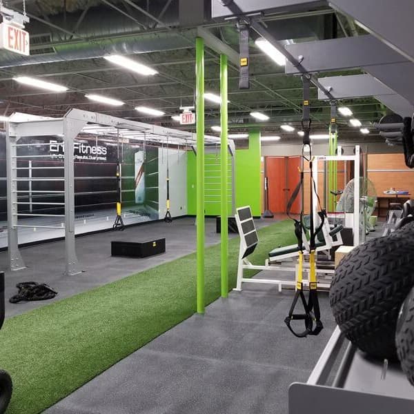 Shock Turf X green artificial grass flooring in gym with exercise equipment