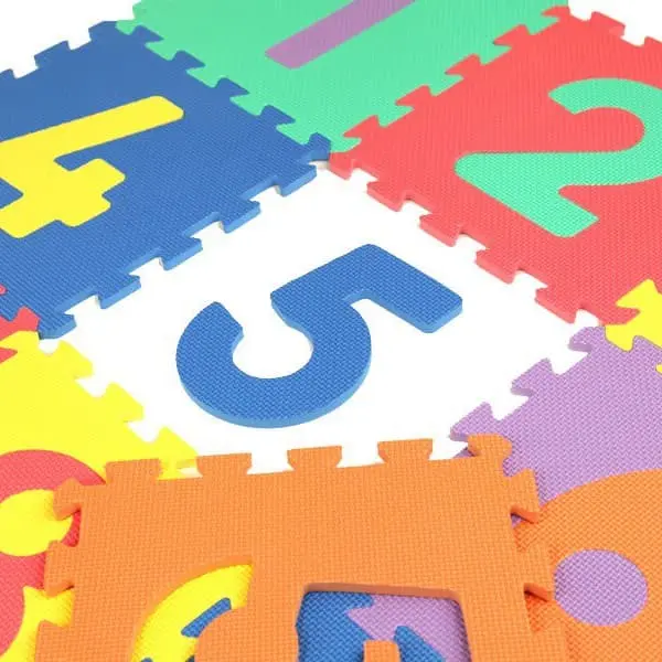Learning Math Puzzle Mat — colorful interlocking foam tiles with raised numbers, soft EVA foam surface close-up