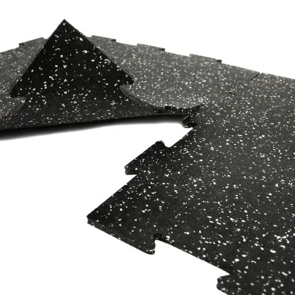 Sure Fit Rubber Tiles — black with white speckle, interlocking tile surface close-up