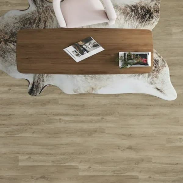 Adura Apex 8" Nordic Oak Luxury Vinyl Planks in Cabin — living room floor with coffee table and cowhide rug