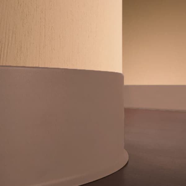 Pinnacle 1/8" x 4' Rubber Wall Base — charcoal rubber trim installed at base of textured wall