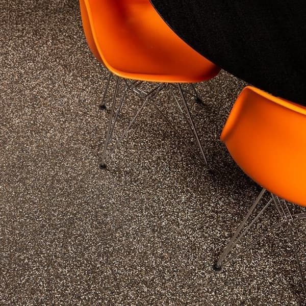 Brown energy rubber tiles under chairs and table.