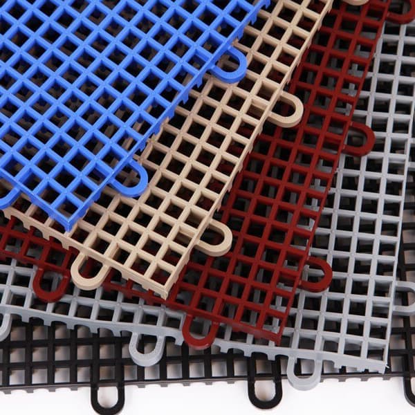 Smooth grip-loc drainage tiles in fan layout with blue, tan, red, gray, and black tiles.