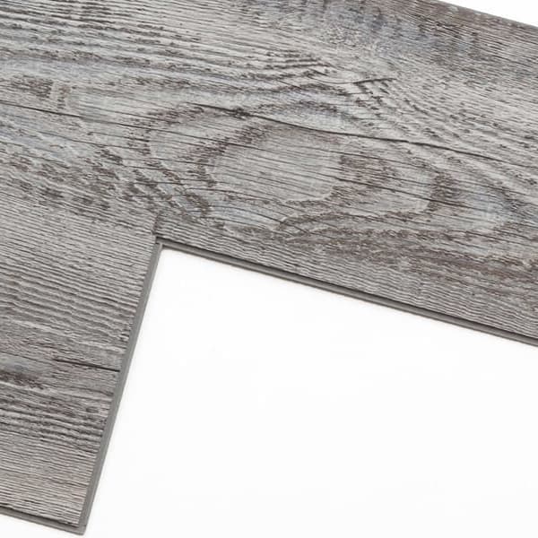Rigid core vinyl plank flooring on white background.