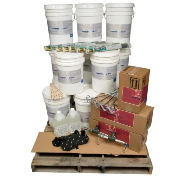 Epoxy floor coating kit on pallet with multiple epoxy buckets, primer containers, boxes of supplies, mixing tools, and rollers.