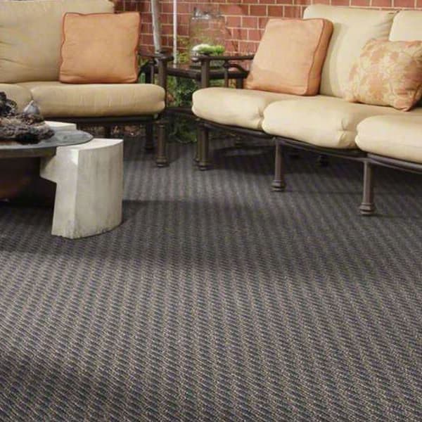 Shaw Pattern Play Outdoor Carpet, Wrought Iron — patio with outdoor furniture and fire pit on textured gray carpet