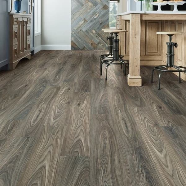 Shaw Anvil Pro Plus 7" rigid core vinyl planks in Gray Chestnut — kitchen floor with wooden island and bar stools