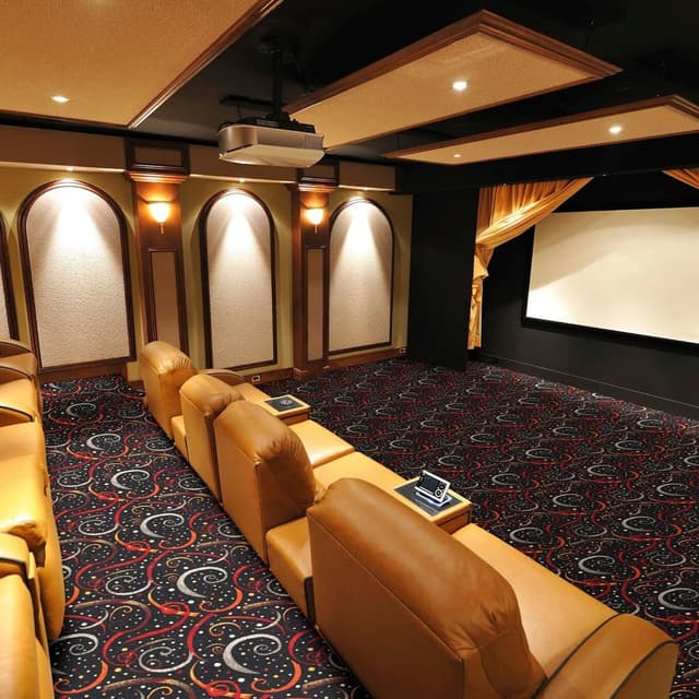 Home theater with Joy Carpets Double Down Carpet, featuring a red, white, and black swirl pattern