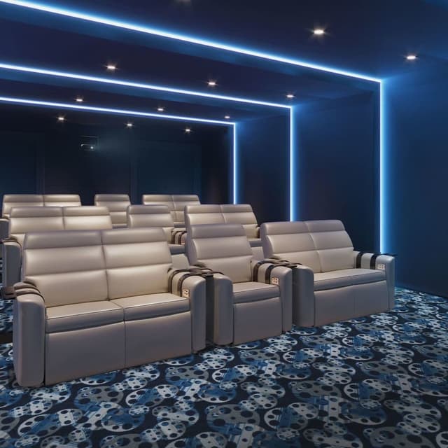 Home theater with Joy Carpets Reeling Carpet in blue and gray film reel pattern