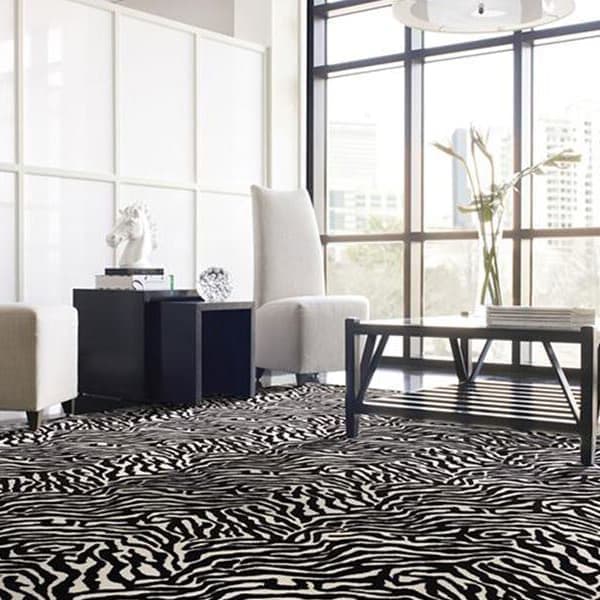 Shaw Zebra Carpet, Wild At Heart — living room with black and white zebra pattern carpet under modern furniture and large