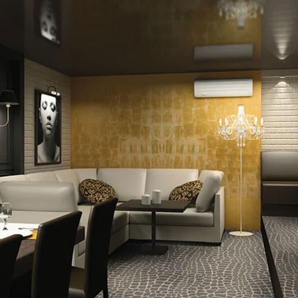 Shaw River Croc Carpet in Floater — living room with gray mosaic pattern carpet under white sectional sofa
