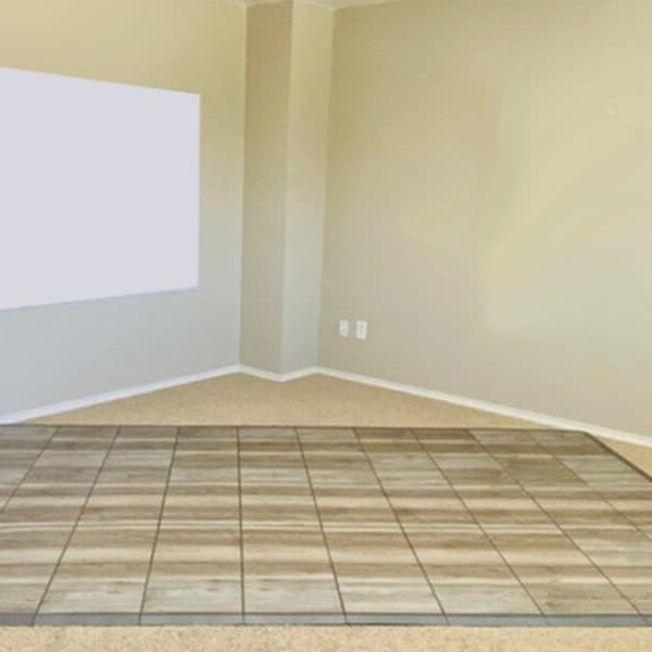Dance floor kit on carpet flooring with a white weight rack and dumbbells.