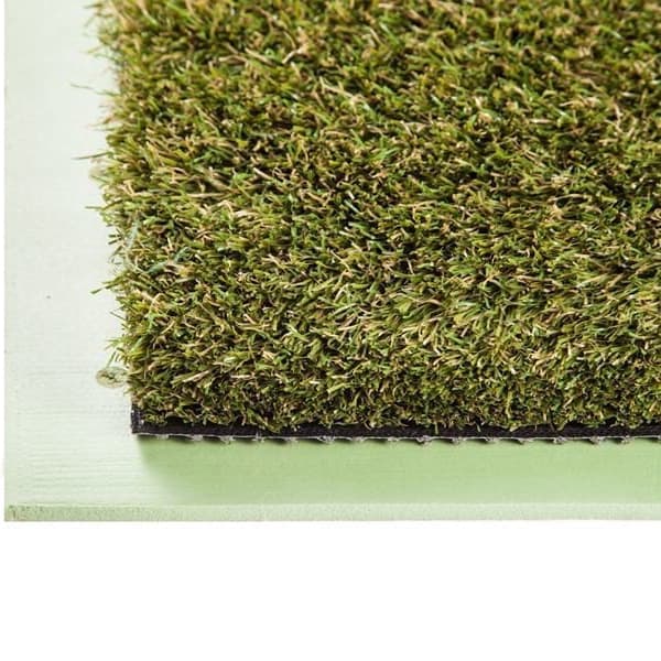 Multi Use Pad artificial grass — green polyurethane turf surface close-up, dense blade texture with black backing edge