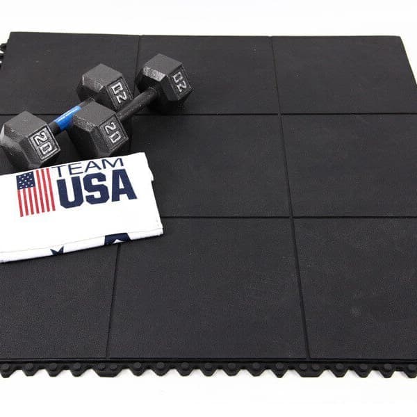 Weights on black, interlocking rubber tiles.