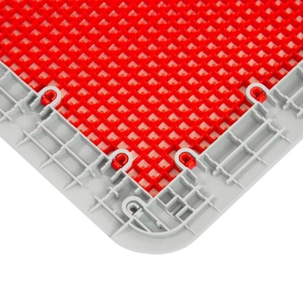 Outdoor Sport Female Corner Edges, gray polypropylene — close-up of interlocking edge detail with red textured tile surface