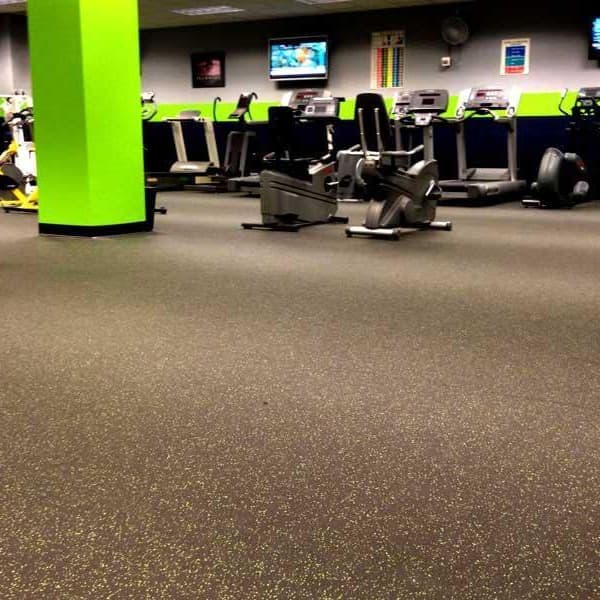 Commercial gym with gray heavy-duty rubber rolls.