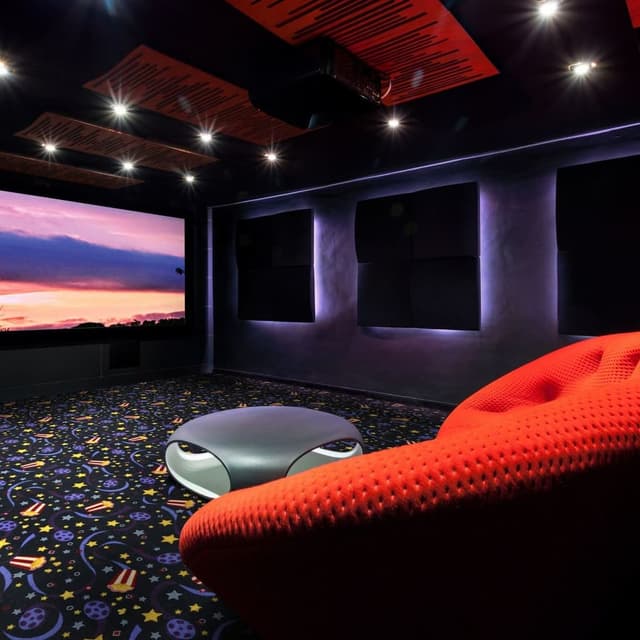 Home theater with Joy Carpets Feature Film Carpet, navy with film reel and star pattern