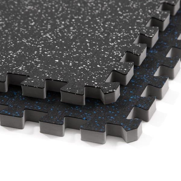 Impact Rubber Tiles, Black/Blue — interlocking rubber foam tiles with speckled surface and puzzle edges, stacked close-up