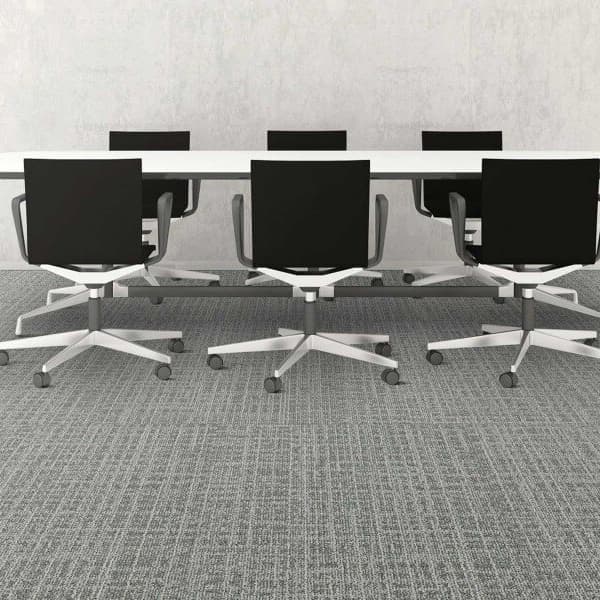 Mannington Mesh Carpet Tiles, Metro — conference room with gray textured carpet under a long table and black office chairs
