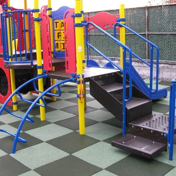Playground with Jamboree Designer Series recycled rubber tiles in green and dark gray checkerboard pattern under play