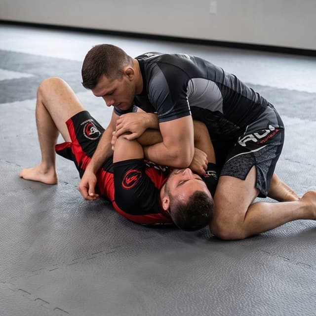 1" MMA Foam Mats — gray EVA foam tiles in a martial arts training room