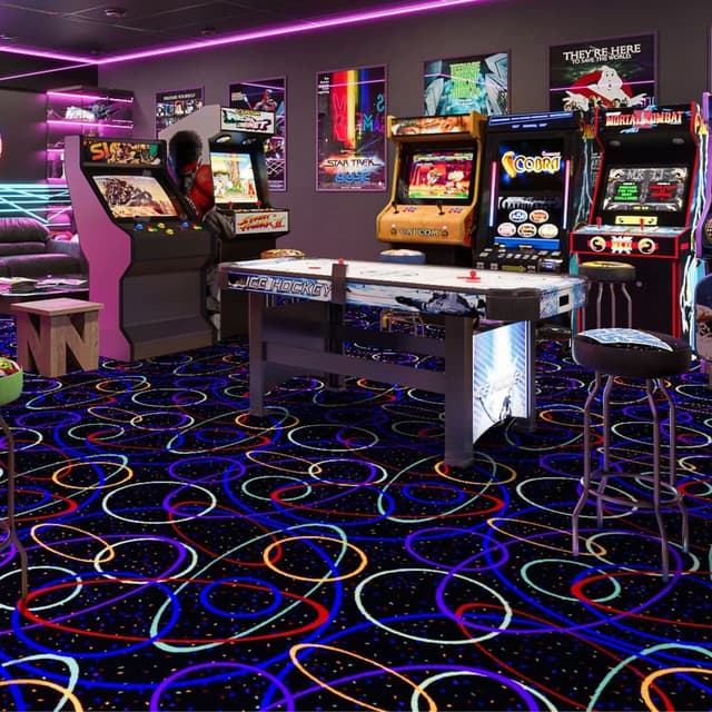 Joy Carpets Neon Lights Carpet — black carpet with colorful looping patterns, installed in a retro arcade room