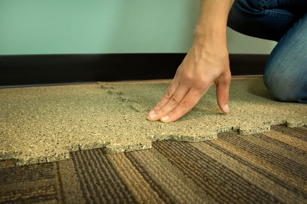 interlocking rubber gym tiles over carpet