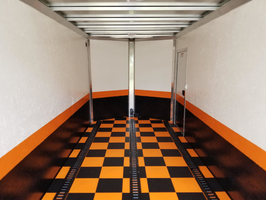Hard plastic tile flooring in a car trailer