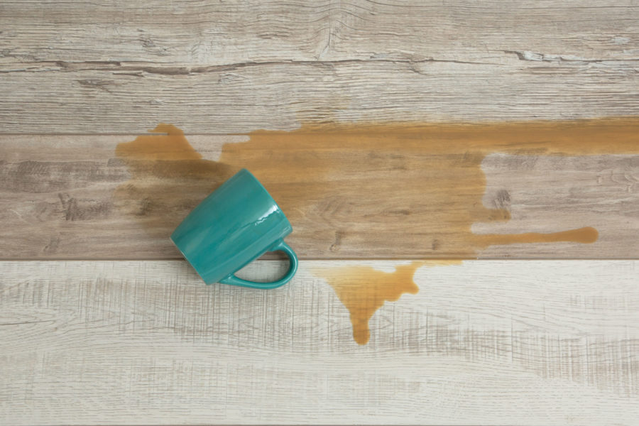 FlooringInc Estate Laminate flooring with spilled coffee mug