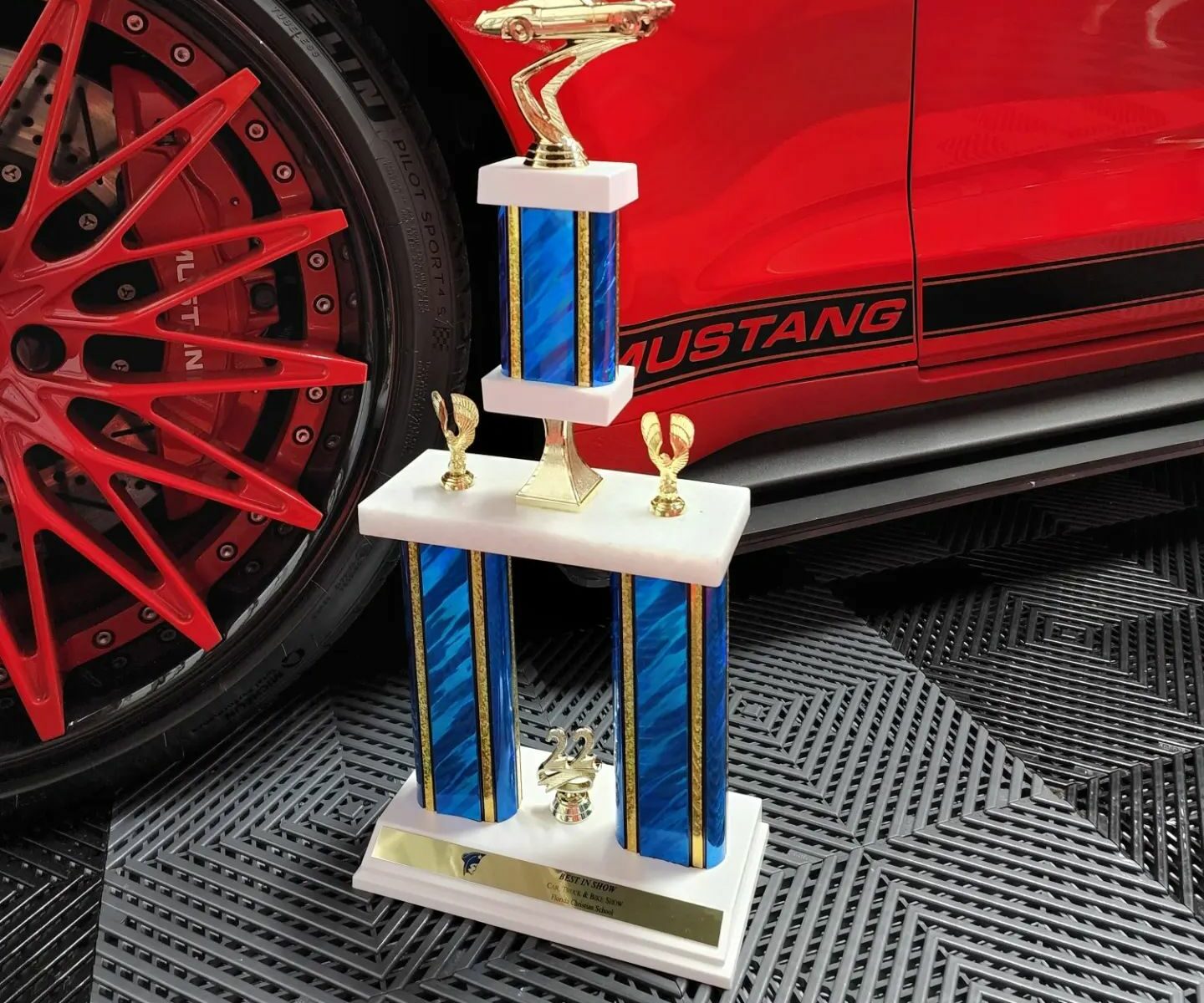 Winning car show trophy sitting on top of our Nitro Tiles with a vented pattern.