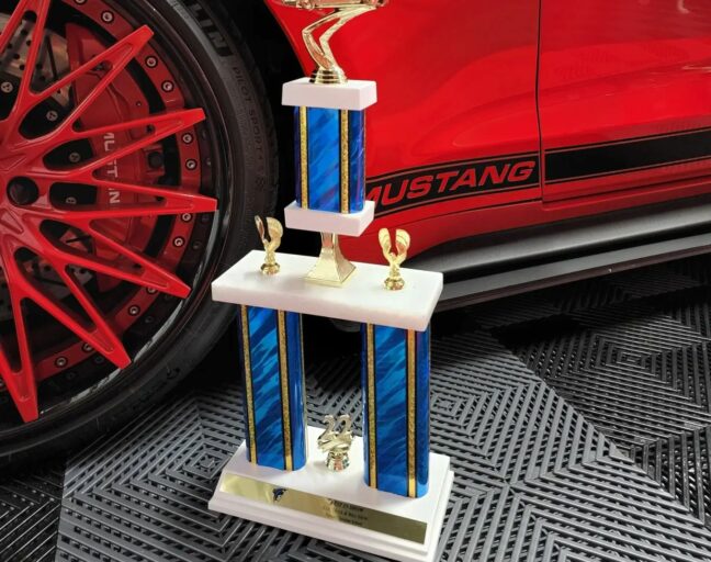 Winning car show trophy sitting on top of our Nitro Tiles with a vented pattern.