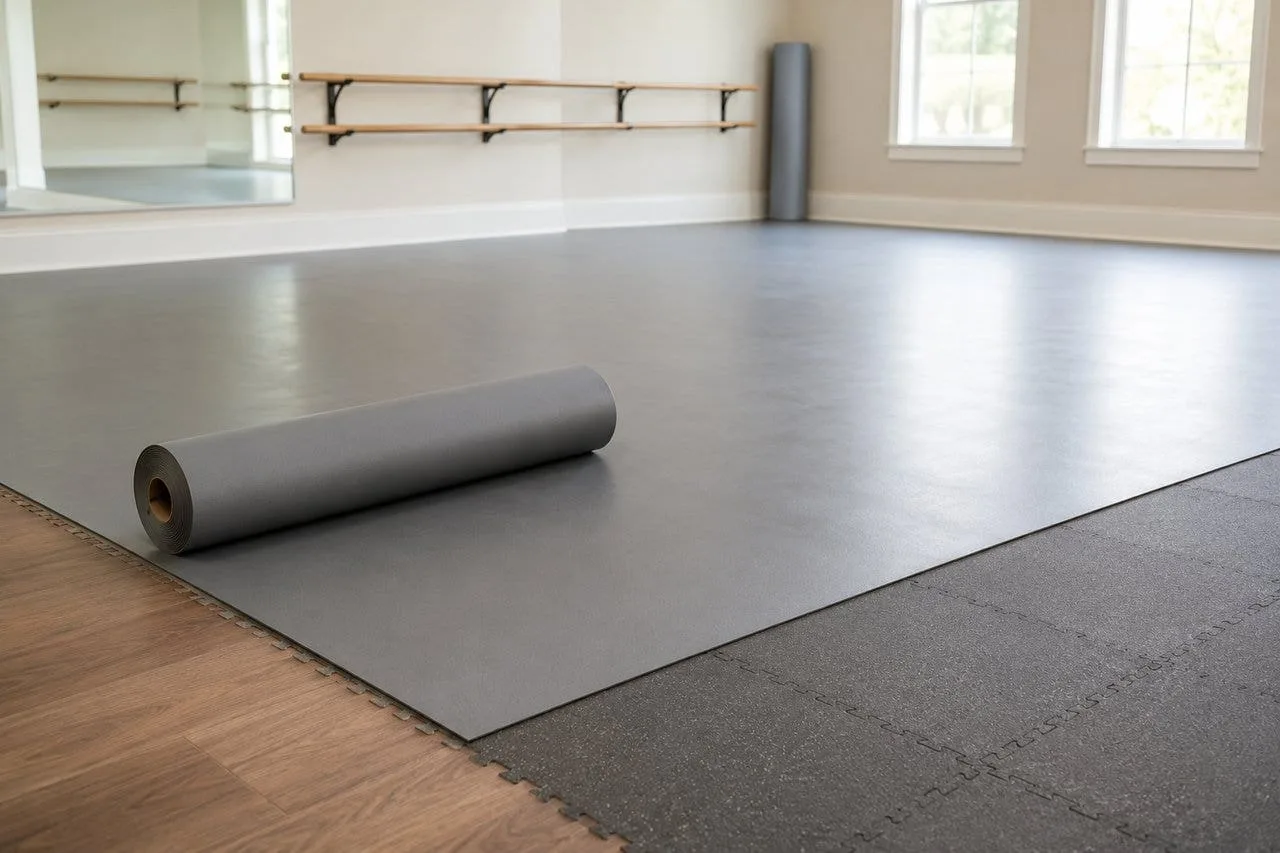 Marley roll partially unrolled over cushioned foam subfloor tiles during installation