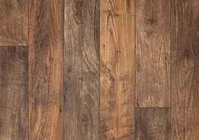 Close-up of rustic wood-look vinyl plank flooring with varied warm tones and realistic wood grain, a durable and stylish alternative to hardwood.