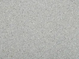 Close-up of a gray textured area rug with subtle speckles, a durable and versatile flooring option for residential spaces.