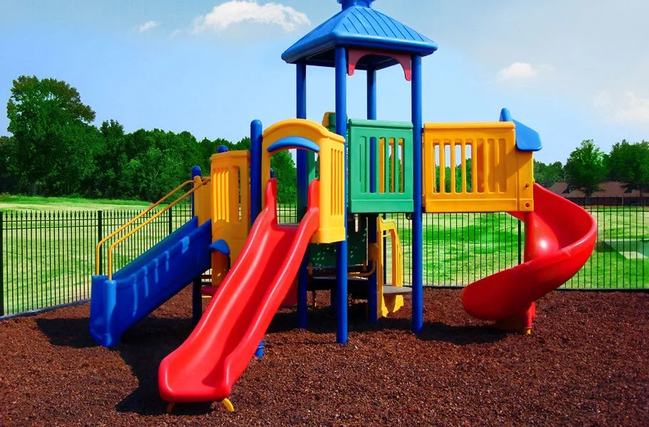 red rubber playground mulch used under a play set.