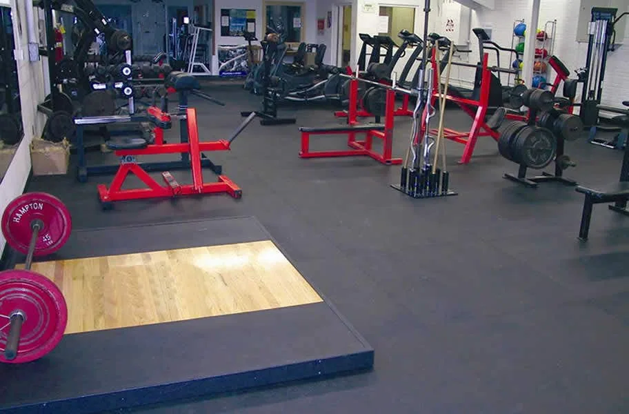 Weight room with a deadlift platform on 3/8" rubber gym tiles