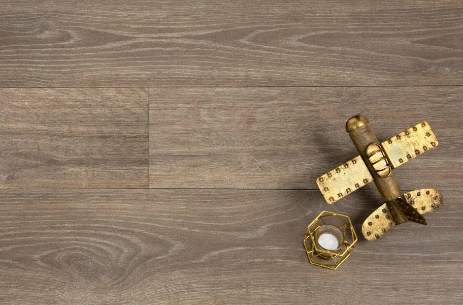 Shop Antique Craft Waterproof Laminate flat lay of brown wooden laminate planks and candle and antique toy plane