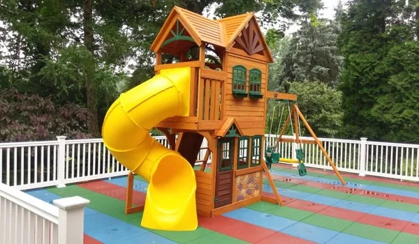 Colorful, residential playground created with our Safe-Play Tiles.