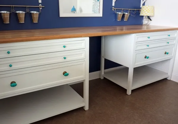 White drawers topped with a DIY bamboo counter top against a blue wall