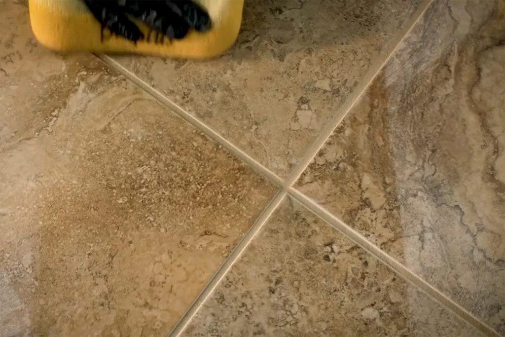 Clearing grout haze with a damp sponge