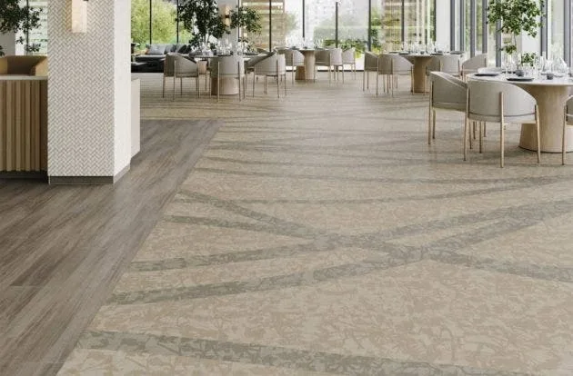 Modern office with a durable gray patterned commercial carpet, a functional and long-lasting flooring solution for a business environment.