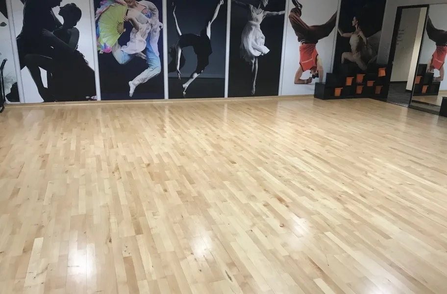 Sprung hardwood dance floor in a bright professional studio