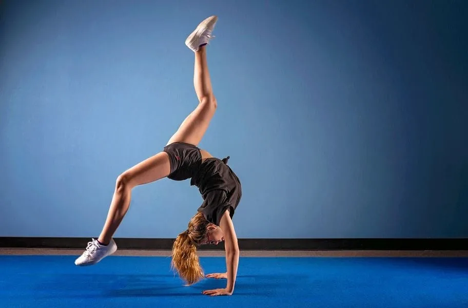 Gymnast using advanced cheer flooring