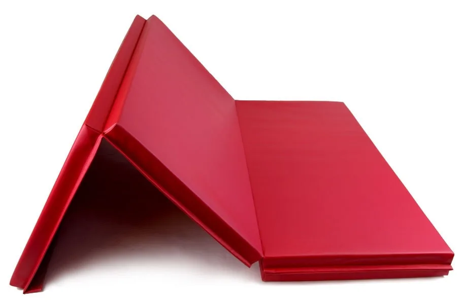 Red folding gymnastics mat