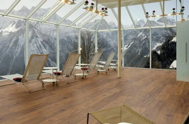 Sunroom with mountain views and KronoSwiss Origin wide plank laminate flooring