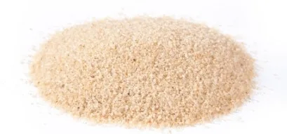 Hydrofill Cooling Sand Turf Infill Granules A close-up shot of turf infill, showing the small granules used to weigh down and support the blades of artificial grass on sports fields and lawns.