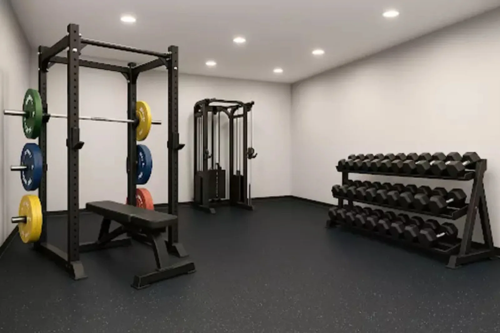 Commercial Grade Gym Equipment Strength training room featuring a squat rack with colorful bumper plates, a functional trainer cable machine, and a full set of dumbbells.