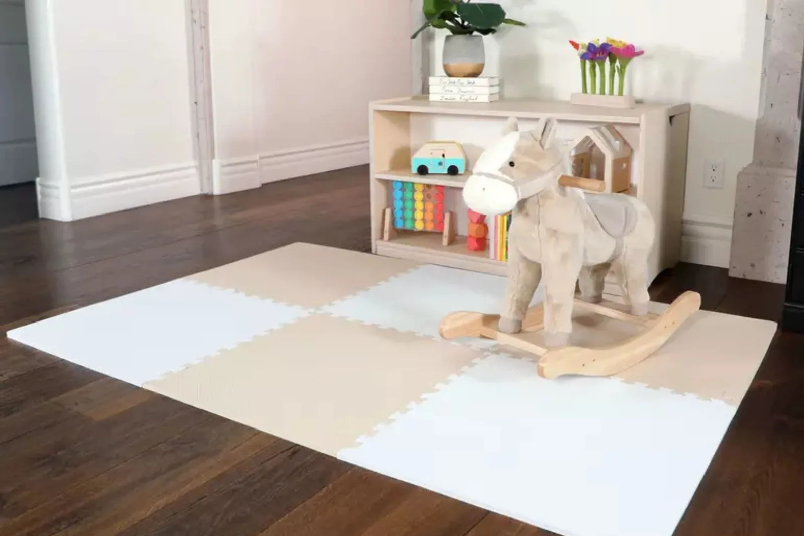 Soft Foam Play Mats for Toddlers Minimalist nursery corner featuring cream and white interlocking foam play mats, a wooden rocking horse, and a low toy shelf with wooden toys.