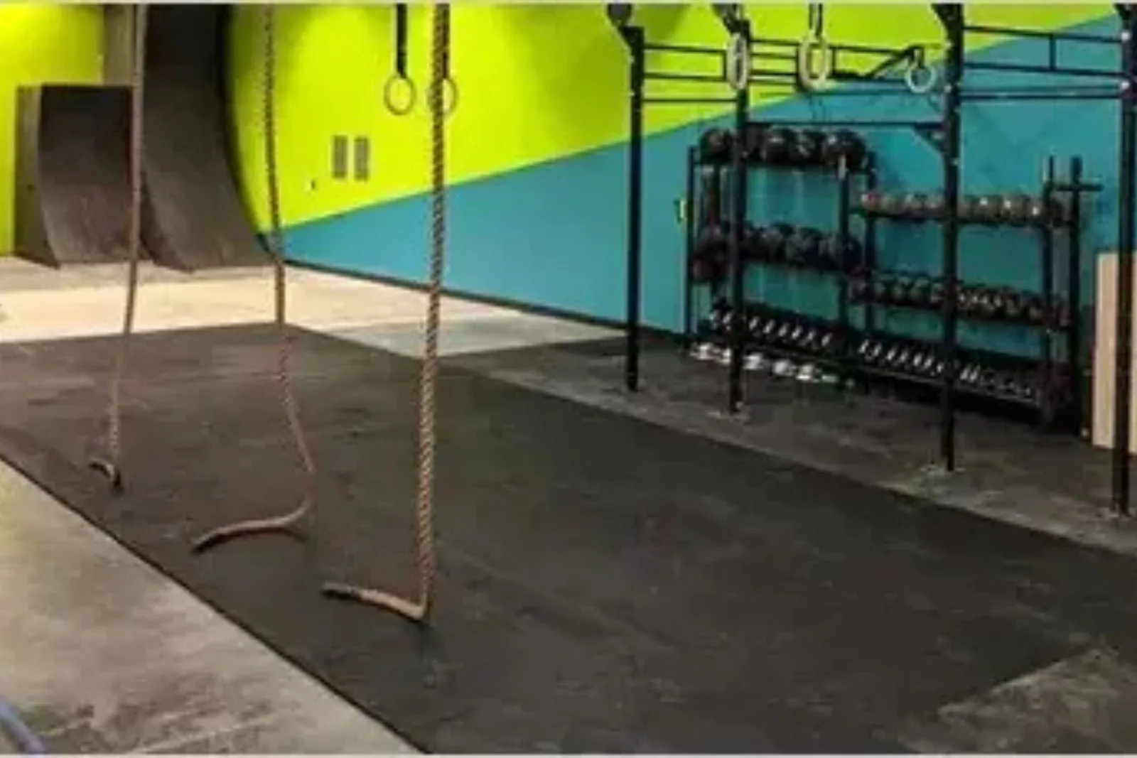 Ninja warrior gym with climbing ropes on 3/4-inch extreme rubber gym mats
